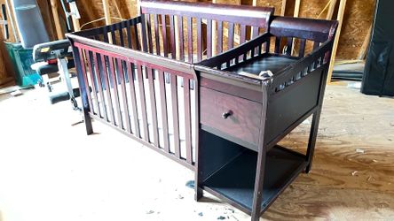 Baby crib with changing staging and mattress