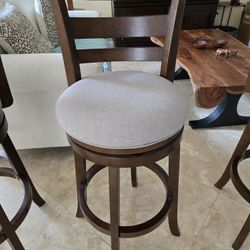 Like New  3 Stools 42 Inch Tall Swivel.