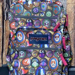 JANSPORT TRANS SUPERMAX BLACK/MULTICOLORED HIPPY BACKPACK