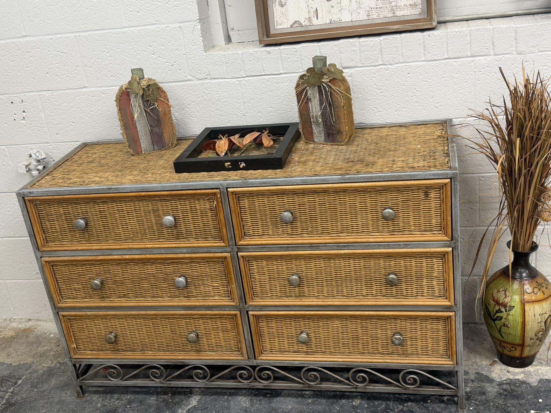 Beautiful wicker and metal dresser — six spacious drawers with a rustic charm! Perfect for a bedroom