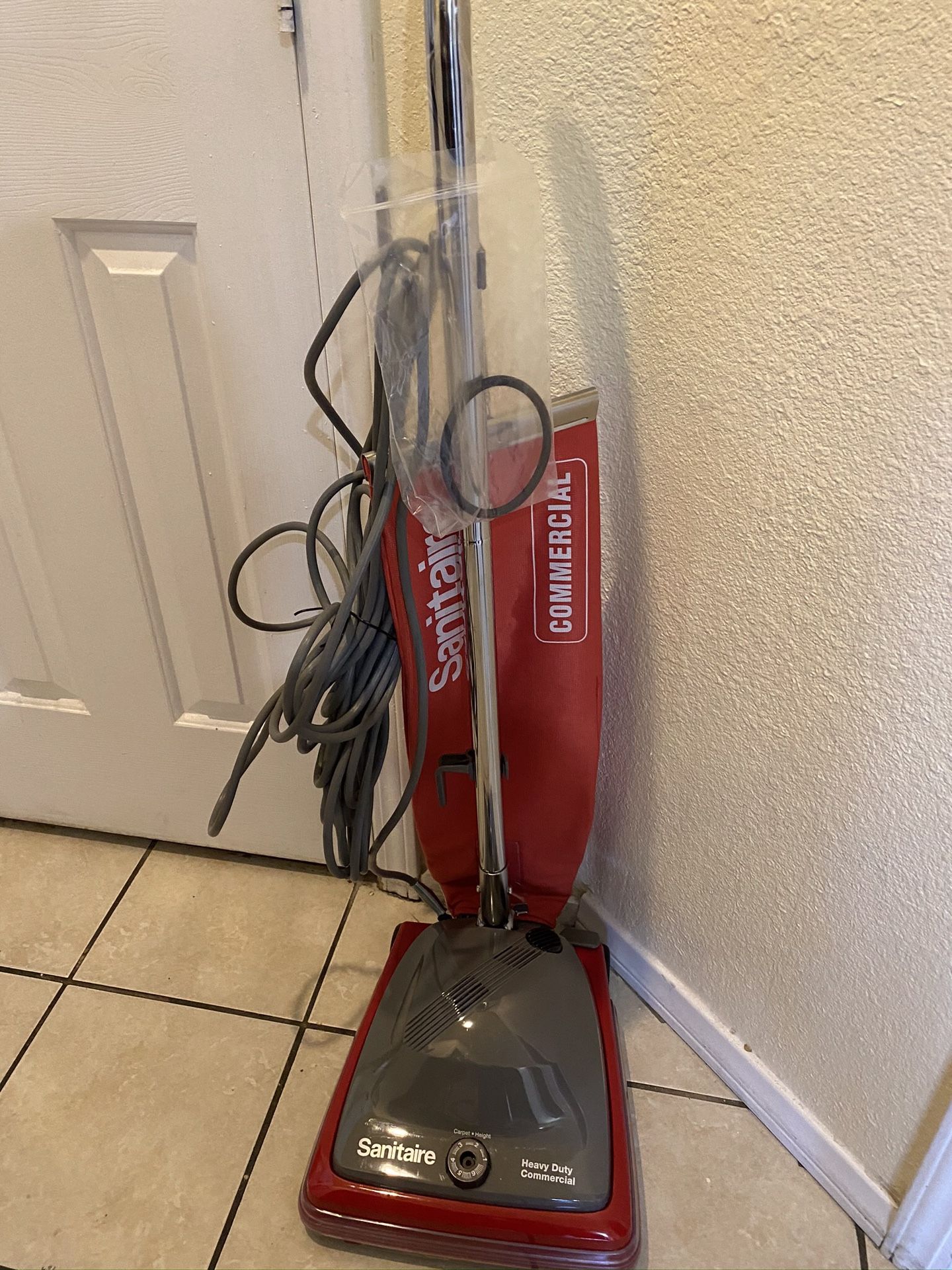 Sanitaire upright commercial bagged vacuum Red vacuum cleaner brand new never used comes in original box