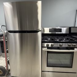 LG top freezer refrigerator & LG 5 burner gas range set
