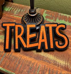 TREATS sign