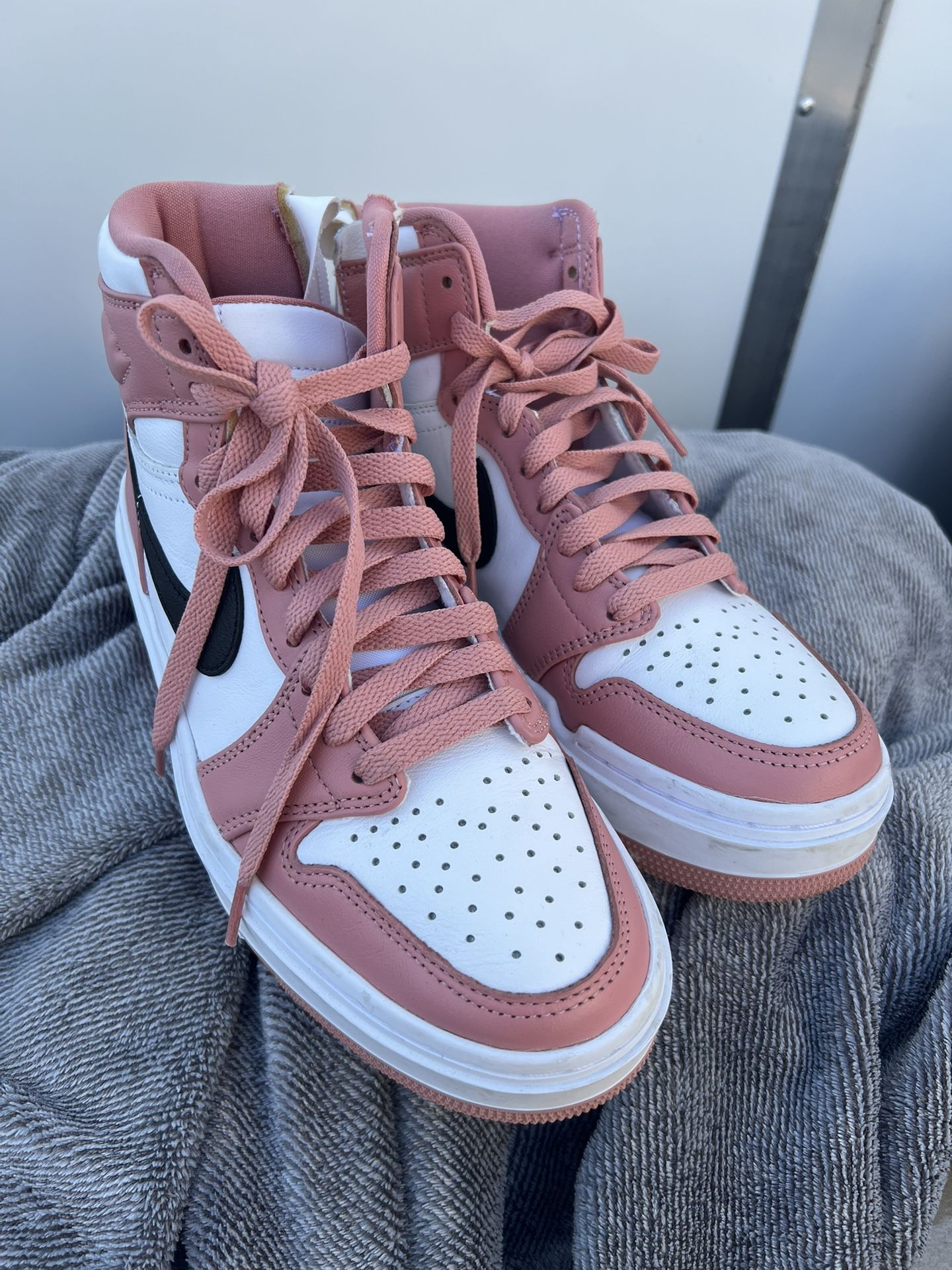 Nike Air Jordan 1 Elevate High in the "Red Stardust" colorway.