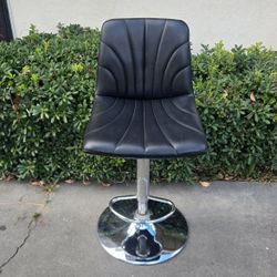 Black padded swivel bar stool
