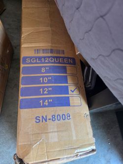 New queen-sized mattress is 12 inches thick. This item is model SN-8008 and comes in its original cardboard packaging