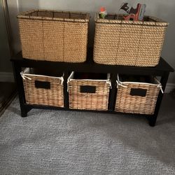 Shelf Stand With Two Rope And Three Wicker Toy Baskets Filled With Toys