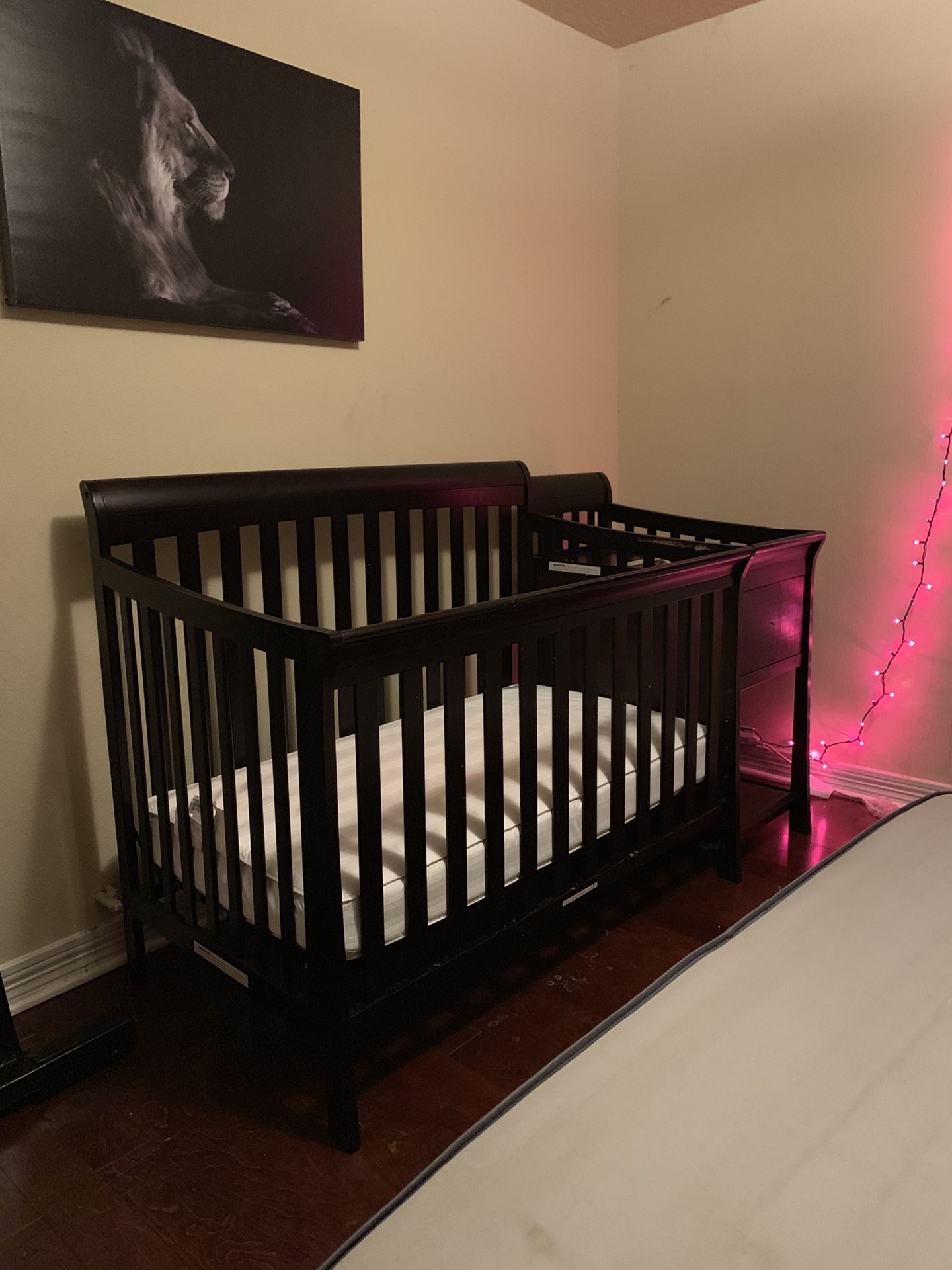 Baby crib with changing table