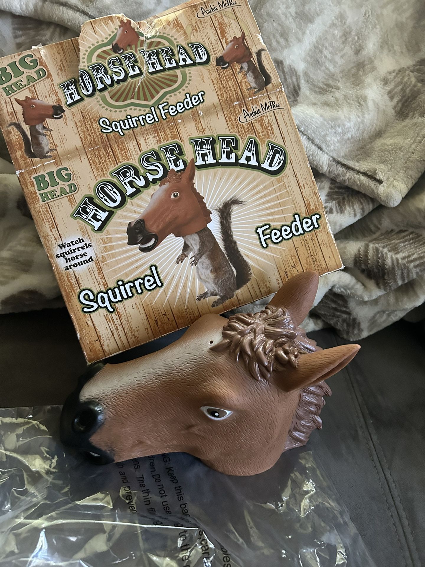 Novelty horse head squirrel feeder