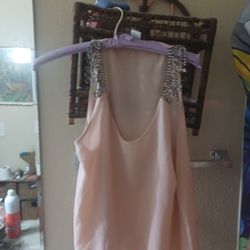 Pink tank top with Rhinestone straps.