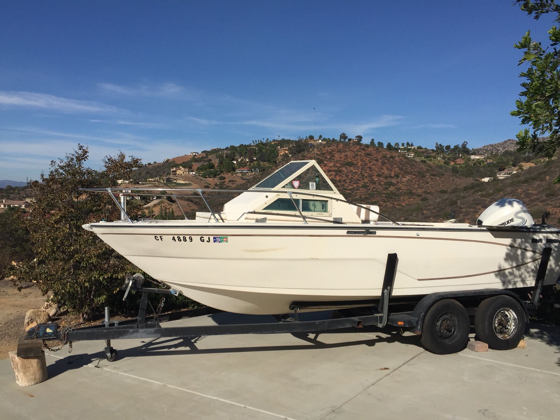 Fishing boat and trailer. 21 ft Glastron.