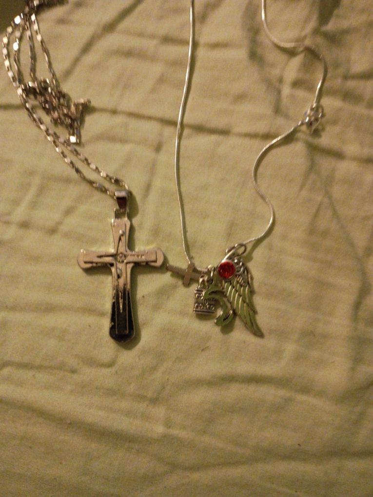 2 Necklaces 1 With Cross 1with Charms Angel Wing And Others In Perfect Condition