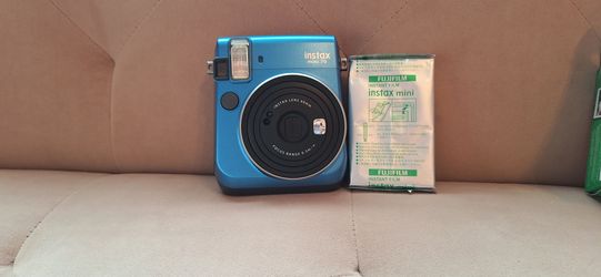 Polaroid camera with film