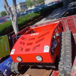 REMOTE CONTROL LAWN MOWER TANK!! WORKS GREAT! LIKE NEW!! 1250$ OBO...TRADE!