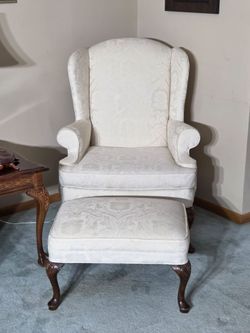 Upholstered wing chair and ottoman White living room chair and ottoman