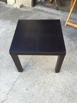 TABLE - Brown wooden table.