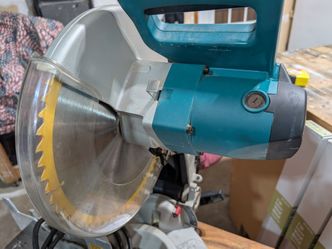 12" Makita Compound Miter Saw with blade.