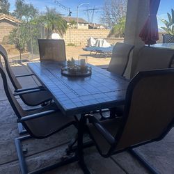 Outdoor patio table with six chairs