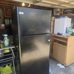 Medium Size Refrigerator. Black Outside. 
