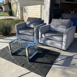 Silver Sofa Chairs And Glass Coffee Table