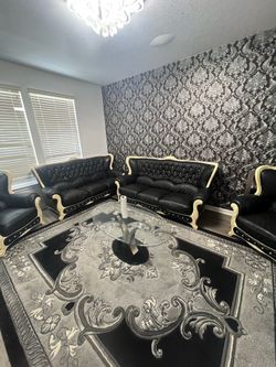 Couch’s. TV stand. Rug. Coffee table.
