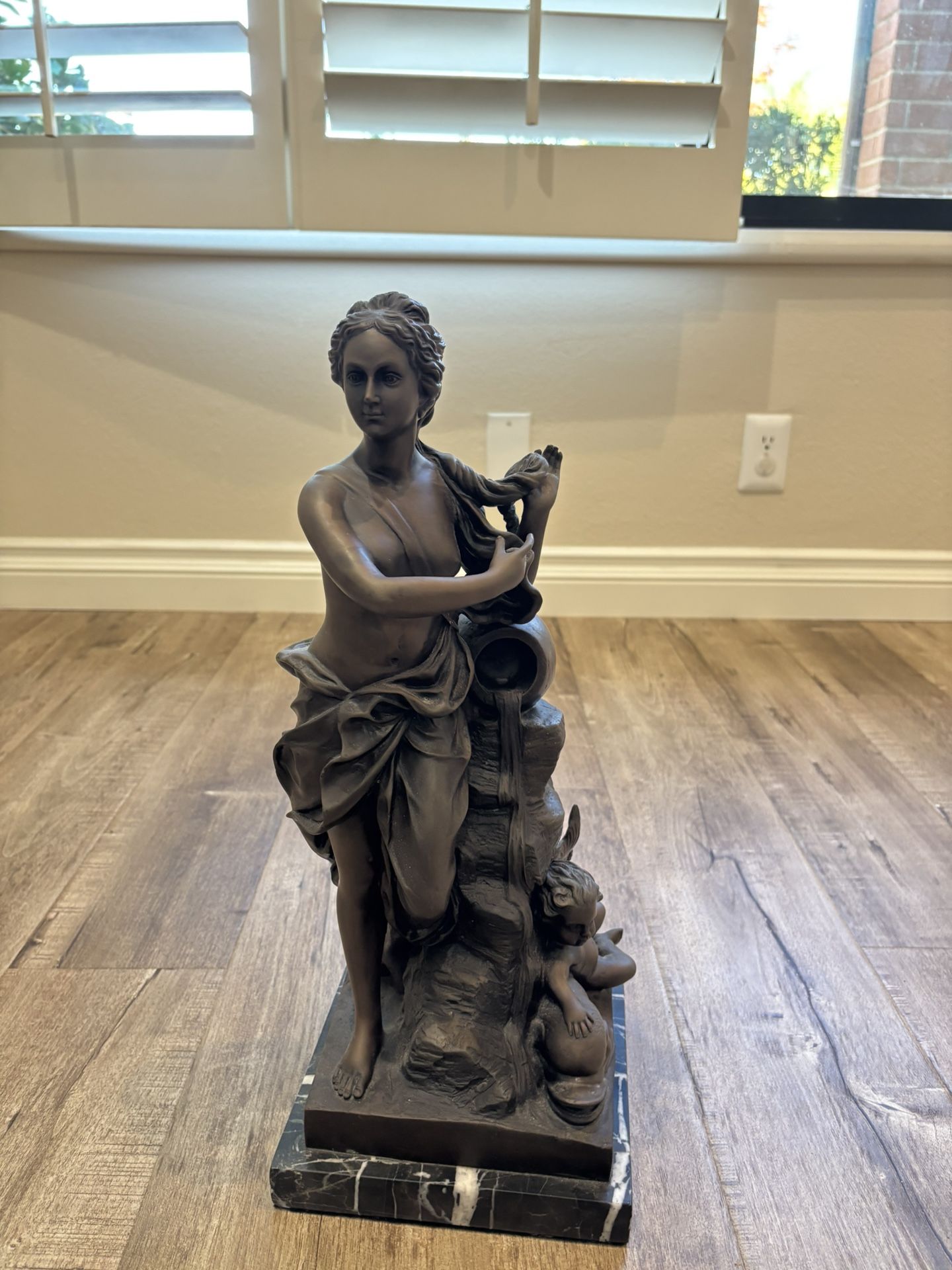 Bronze Statue on Marble Stand  20  inches tall .