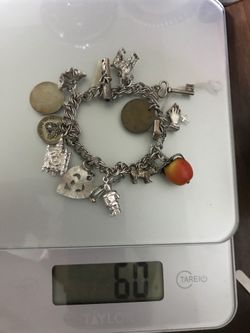 60 gram sterling silver bracelet with 14 sterling silver pendents