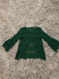 Adorable green lace women’s top. Size L but fits more like a small. Zips up back w/half open back