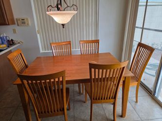 Pending pickup. Wood dining table with 6 chairs