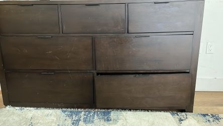 Dark brown dresser with multiple drawer