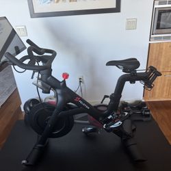 Peloton PL-01 Exercise Bike; Excellent Condition, Mat, Dumb Bells, Heart Monitor