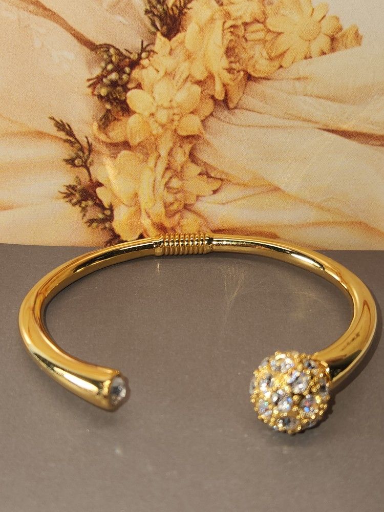 #1852, KENNETH J LANE, RHINESTONE HINGED CUFF BRACELET KJL. GOLD PLATED