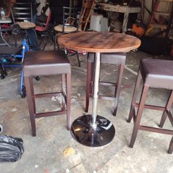 Adjustable Table With 3 high Wooden Chairs 