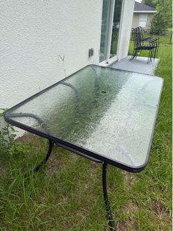 Outside glass table and chairs
