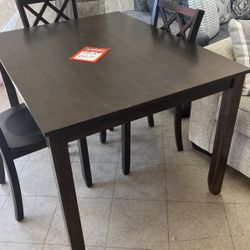 Brand new table and four chairs for $450