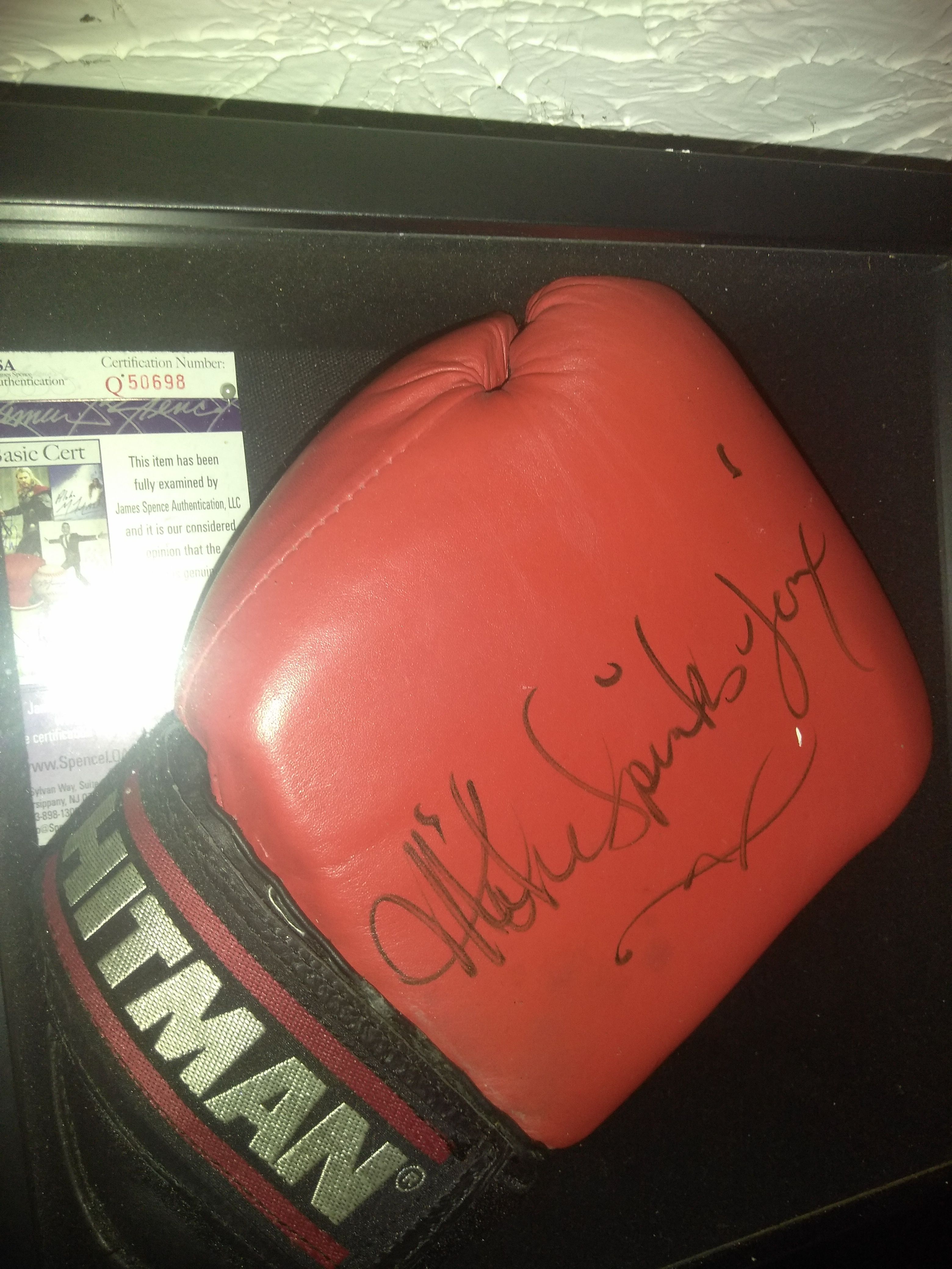 Hand signed Michael spinks hitman boxing glove with JSA certificate of authenticity in display case