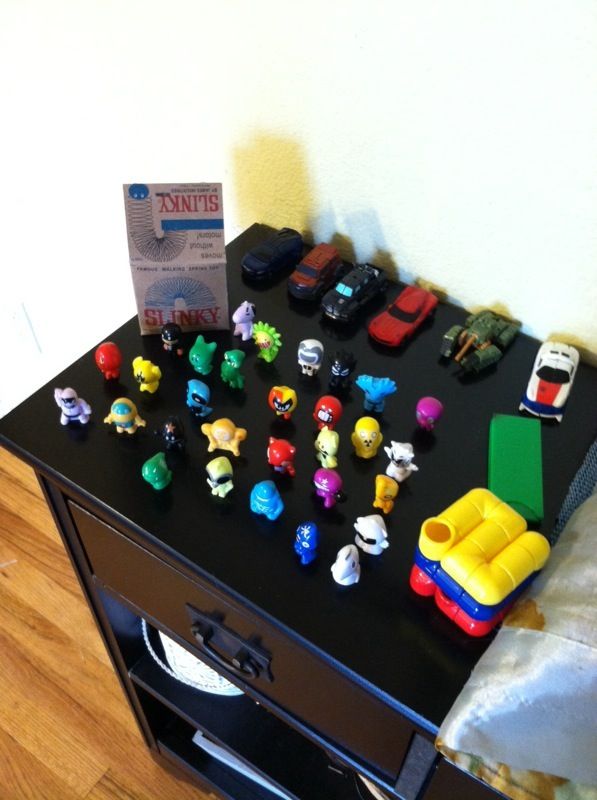 Assorted toys. Slinky. Gogos Crazy bones, transformers, cubic tube