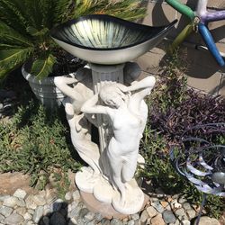 Yard statues and small antique bench for kids