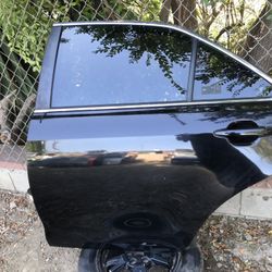 LEFT REAR DOOR (DRIVER SIDE) 2007-2011 TOYOTA CAMRY (black Color).