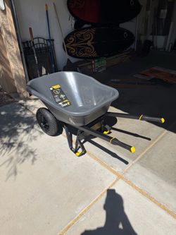 Gorilla 8 cu. ft. Dual-Wheel Wheelbarrow, Pro-Grade Poly Bucket, Steel Handles, Dual 16 in. Pneumatic Wheels, Easy-Dump Design