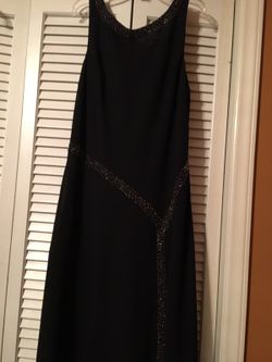 Black party dress. Beaded neckline and sides. Size 14.