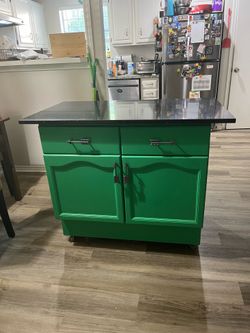 Green Kitchen Island with Black Countertop