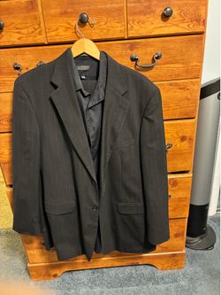 Men’s black (striped) suit.  Jacket 44R, arms 25 inches, pants 38x32, shirt large.