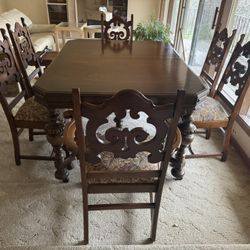 antique Jacobean-style oak dining set,