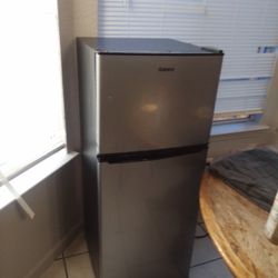 A Brand New Rv Or Doorm Size Refrigerator<