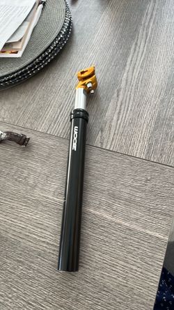 Zoom Bike Seatpost with Gold Clamp and shock absorption.