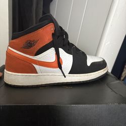 Jordan 1 mid orange and black