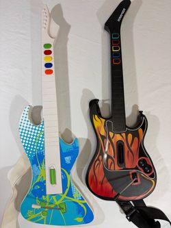 React Odyssey Wireless Guitar and a RedOctane Kramer Striker Wireless Guitar