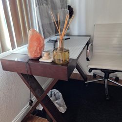 Brown wood desk and office chair