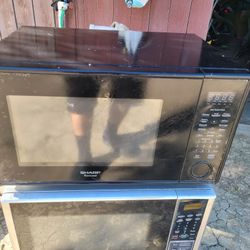 Kenmore Microwave And  Black One Is Sharp Brand